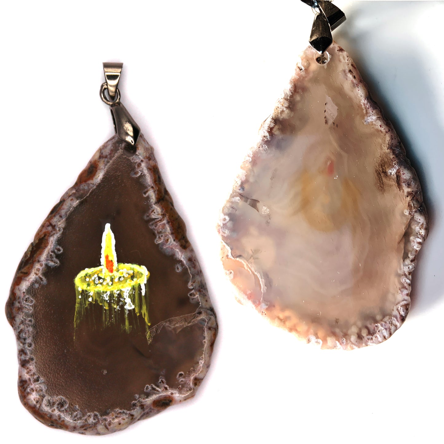 The front and back of the pendant. The back is mostly a creamy swirling beige. The orange at the center of the candle flame painted on the front does slightly show through.